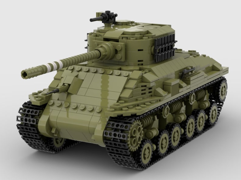 May include: A green Lego model of a tank with black tracks and a detailed gun turret.