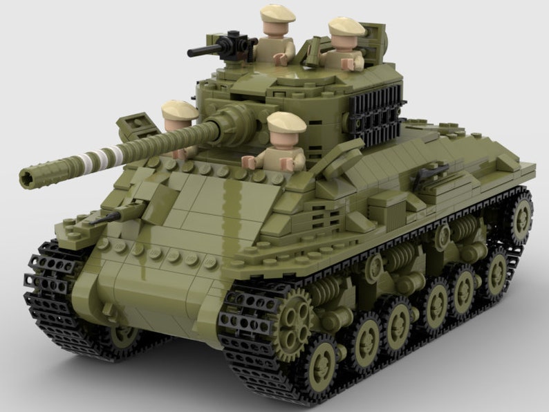 May include: A green toy tank with four minifigures on top. The tank has a long gun barrel and tracks on the bottom.
