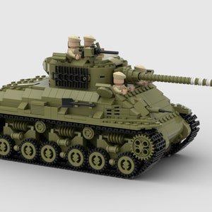 May include: A green toy tank with three minifigures on top. The tank has a long barrel and tracks. The minifigures are wearing tan hats and holding guns.