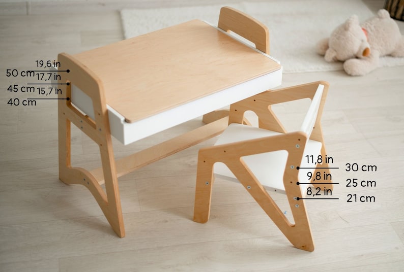 May include: A wooden children's desk and chair set with a white drawer. The desk measures 19.6 inches tall and the chair measures 11.8 inches tall.