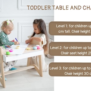 May include: A white wooden table and chair set for toddlers, with adjustable height settings. The table has a white surface and a built-in storage shelf. Two children are sitting at the table, coloring on a piece of paper. Level 1: for children up to 100 cm tall. Chair height 21 cm. Level 2: for children up to 115 cm tall. Chair seat height 25 cm. Level 3: for children up to 130 cm tall. Chair height 30 cm.