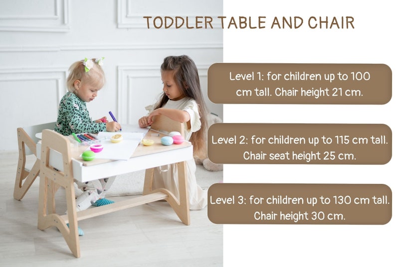 May include: A white wooden table and chair set for toddlers, with adjustable height settings. The table has a white surface and a built-in storage shelf. Two children are sitting at the table, coloring on a piece of paper. Level 1: for children up to 100 cm tall. Chair height 21 cm. Level 2: for children up to 115 cm tall. Chair seat height 25 cm. Level 3: for children up to 130 cm tall. Chair height 30 cm.