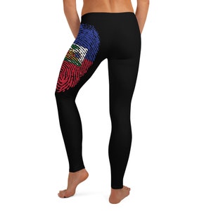 May include: Black leggings with a fingerprint design featuring the Haitian flag colours of red, blue and white.