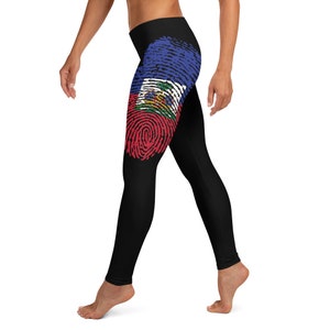 May include: Black leggings with a fingerprint design featuring the Haitian flag colours of blue, red and white.