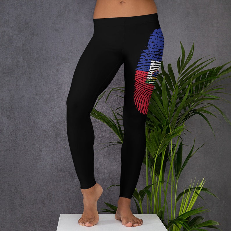 May include: Black leggings with a fingerprint design featuring the Haitian flag colours of blue, red and white.