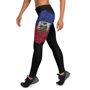 May include: Black leggings with a fingerprint design featuring the Haitian flag colours of red, blue and white.