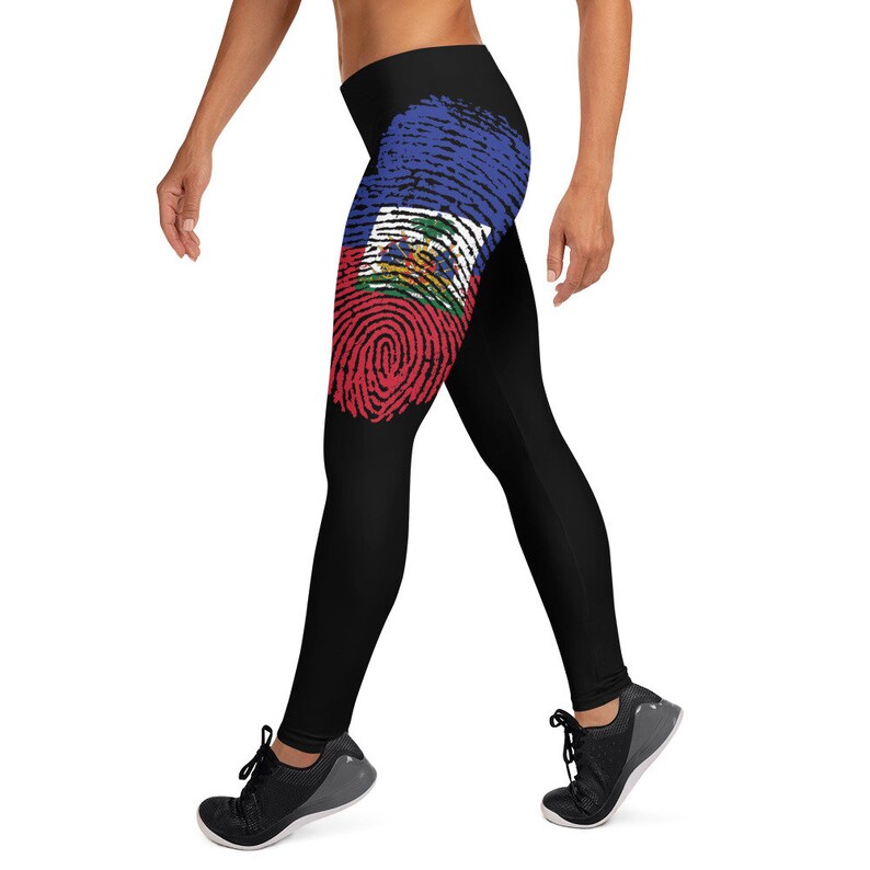 May include: Black leggings with a fingerprint design featuring the Haitian flag colours of red, blue and white.