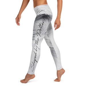 May include: White leggings with a black and white abstract print and the text "Shaped by the Potter" on the side.