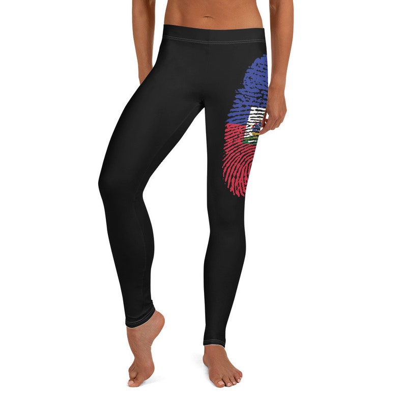 May include: Black leggings with a fingerprint design featuring the Haitian flag colours of red, blue and green.