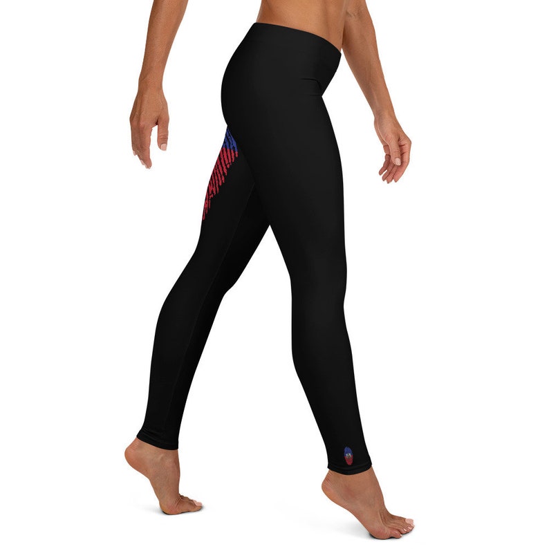 May include: Black leggings with a red, white and blue graphic print on the left leg. The graphic print is a stylised design of a flag.