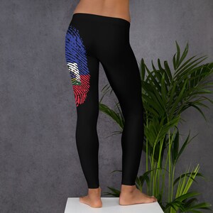 May include: Black leggings with a fingerprint design featuring the flag of Haiti on the left leg.