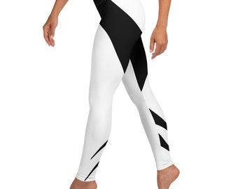 May include: White leggings with a bold black geometric design. The leggings feature a high waist and a striking pattern of black shapes on a white background, creating a modern and athletic look. The leggings are made of a stretchy material.