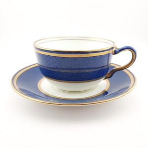 Antique Wedgwood teacup and saucer, bone china. Powder blue and gold English cup and saucer, 1900s