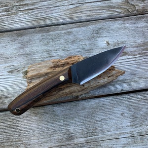 Full tang, 1084 high carbon steel, fiber liners, brass hardware and oil-finished zircote wood scales. Blade length of 3.5" and an overall length of ~8". Handmade right here in Maine.

This knife is made to order with a turnaround time of 1-2 weeks, if you would like to customize your order in any way please send us a message. Please be aware that customization may lengthen the time it takes me to make your knife.