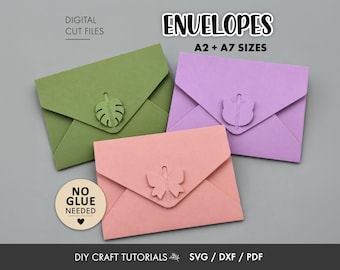 May include: Three paper envelopes in olive green, lavender, and peach, each featuring a unique die-cut closure: a monstera leaf, a cat head, and a butterfly. Text includes DIGITAL CUT FILES, ENVELOPES A2 + A7 SIZES, NO GLUE NEEDED, and DIY CRAFT TUTORIALS SVG / DXF / PDF.
