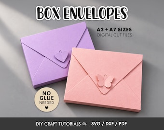 May include: Two box envelopes in light purple and soft pink, featuring a heart-shaped closure on the purple envelope and a butterfly-shaped closure on the pink one. Text includes BOX ENVELOPES, A2 + A7 SIZES DIGITAL CUT FILES, NO GLUE NEEDED, and DIY CRAFT TUTORIALS SVG / DXF / PDF.