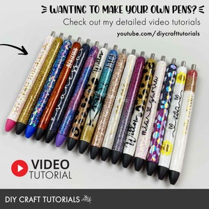 May include: A collection of 15 personalized glitter pens with various designs and colors. The pens are arranged in a row, with the tips facing the right side of the image. The text "WANTING TO MAKE YOUR OWN PENS?" is at the top of the image, and the text "VIDEO TUTORIAL" is at the bottom of the image. The text "DIY CRAFT TUTORIALS" is at the bottom of the image.