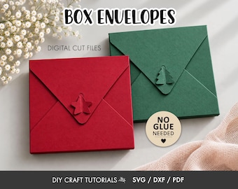 May include: Two square box envelopes in red and dark green, each featuring a decorative paper closure in the shape of a star or tree. The text reads BOX ENVELOPES, DIGITAL CUT FILES, and NO GLUE NEEDED, with DIY CRAFT TUTORIALS SVG / DXF / PDF.