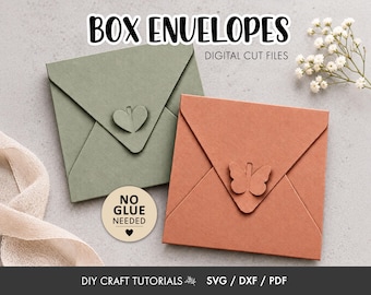 May include: Two square paper envelopes in sage green and terracotta, each featuring a die-cut closure in the shape of a heart or butterfly. Text reads BOX ENVELOPES DIGITAL CUT FILES, NO GLUE NEEDED, and DIY CRAFT TUTORIALS SVG DXF PDF.