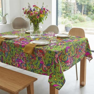 May include: A rectangular tablecloth featuring a vibrant, multi-coloured abstract pattern on a lime green background. The design includes swirling shapes, geometric lines, and organic forms in shades of pink, blue, yellow, and purple, covering the entire surface.