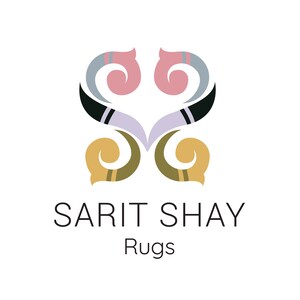 May include: A logo featuring a symmetrical, stylized floral or scroll-like emblem in shades of pink, light blue, black, and gold. Below the emblem, the text reads SARIT SHAY in capital letters, followed by the word Rugs in smaller font.