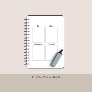 May include: A white spiral-bound planner insert featuring four rectangular sections labeled Tv, film, Audiobooks, and Podcast in black text. A light gray marker is positioned diagonally across the bottom right section of the page.