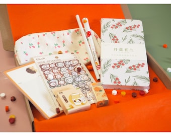 Coffret cadeau papeterie : agenda, autocollants et trousse fleuris triés sur le volet