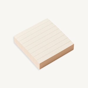 May include: A stack of lined sticky notes with a light brown backing.