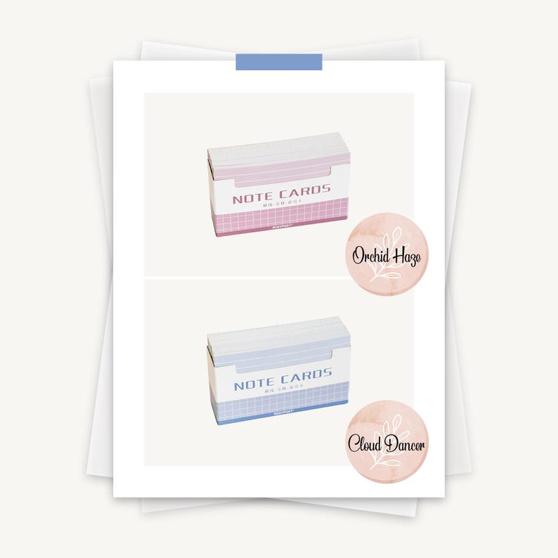 May include: Two boxes of note cards, one pink and one blue, with the text "NOTE CARDS" on the front. The pink box has a sticker that says "Orchid Haze" and the blue box has a sticker that says "Cloud Dancer".