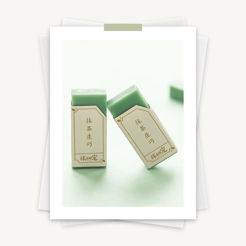May include: Two green rectangular erasers with white labels. The labels have gold lettering that reads "抹茶 生方" and "抹茶 限定".