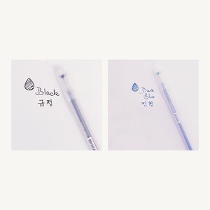 May include: Two clear plastic pens with black and dark blue ink. The pens are labeled "Black" and "Dark Blue" in Korean and English.