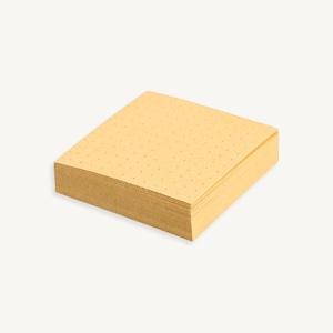 May include: A stack of yellow sticky notes with a dotted pattern.