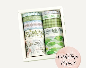 May include: A set of 10 rolls of washi tape in a white box. The tape has various patterns featuring green leaves, flowers, and geometric designs. The box has a label that says "Washi Tape 10 Pack".