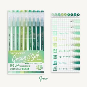 May include: A set of eight green gel pens in a clear plastic case. The pens are labeled "Green Style" and feature different shades of green ink. The ink colors are labeled "Magic Mint", "Key Lime", "Jasmine Green", "Spring Bouquet", "Light Emerald", "Sea Green", and "Rain Forest".