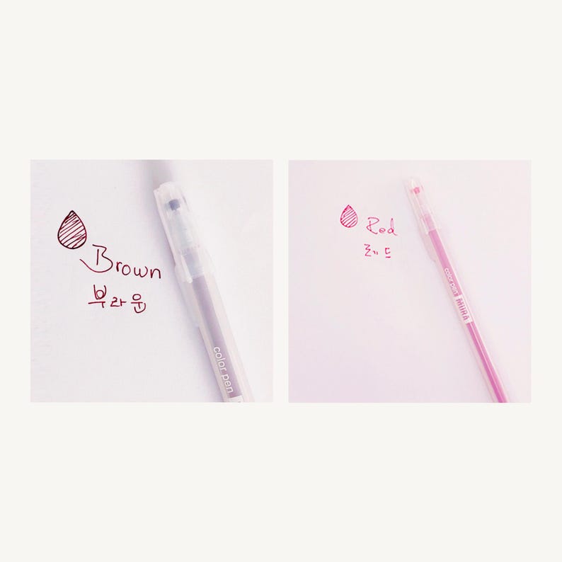 May include: Two clear gel pens with color swatches and text. The pen on the left is brown and says "Brown" and "브라운". The pen on the right is red and says "Red" and "레드".