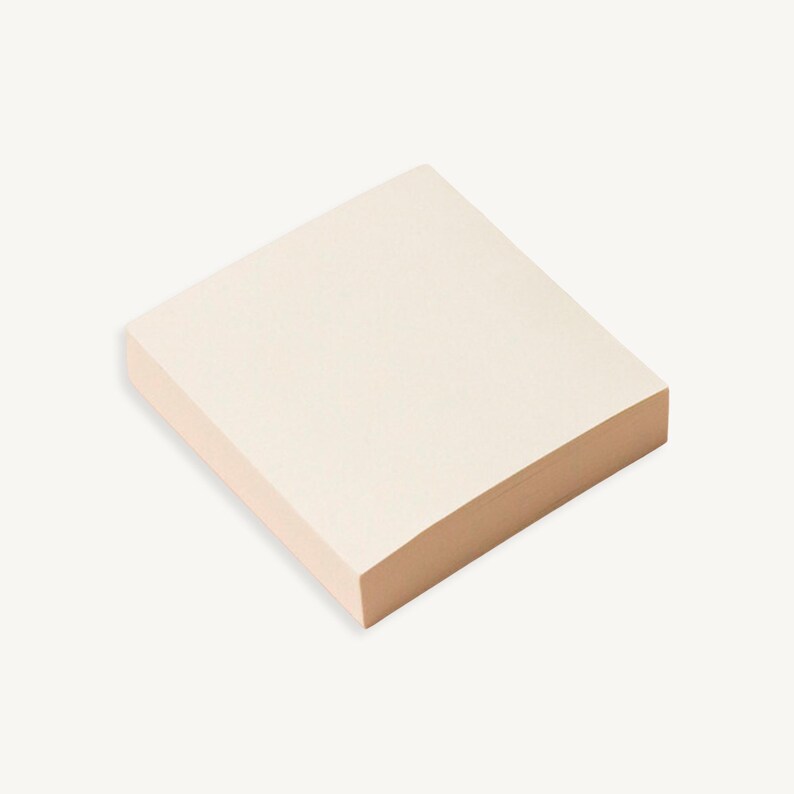 May include: A stack of off-white sticky notes with rounded corners.