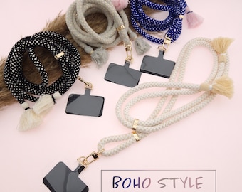 May include: Three colorful braided rope lanyards with black, white, and blue accents. Each lanyard has a gold clasp and a black rectangular tag. The text "BOHO STYLE" is printed in white on a black background.