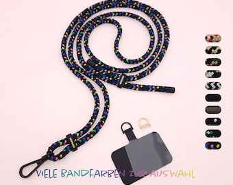 May include: Black braided lanyard with colorful accents and a gold metal clasp. The lanyard has a black phone holder with a clear plastic window. The text "VIELEN BANDFARBEN ZUR AUSWAHL" is visible at the bottom of the image.