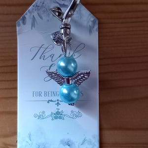 Llaveros de ángel azul con tarjeta de agradecimiento