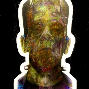 May include: A sticker featuring a close-up of Frankenstein's monster's face. The image is a colorful, abstract interpretation of the classic monster.