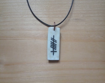 antler pendant with ogham, "Gra" (love in gaelic)