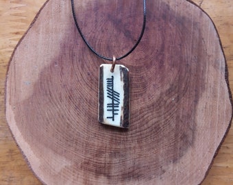 Antler pendant with Ogham "Croabh" (Tree in Gaelic)