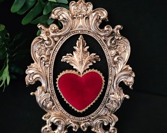 Framed red velvet sacred heart with gold flourish, gothic art. Mounted on black velvet in a metallic gold hand cast ornate frame.