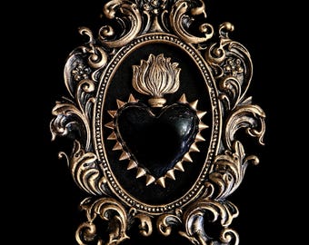 Framed black sacred heart with gold flame and spiked edging, gothic art. Mounted on black velvet in a burnished gold hand cast ornate frame.