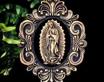 Our lady of Guadelupe in a burnished gold ornate oval frame, gothic, wall art.