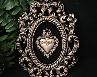 Gold sacred heart , gothic art. Mounted on black velvet in a burnished gold hand cast ornate frame.