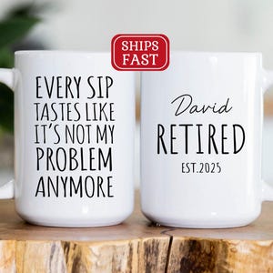 May include: Two white coffee mugs with black text. One mug says "Every Sip Tastes Like It's Not My Problem Anymore". The other mug says "David Retired EST. 2025".