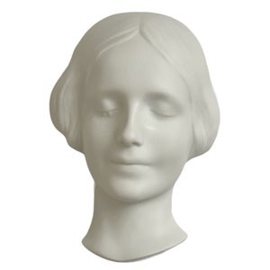 Máscara de parede de Goebel "L'inconnue De La Seine" (A mulher desconhecida do Sena)