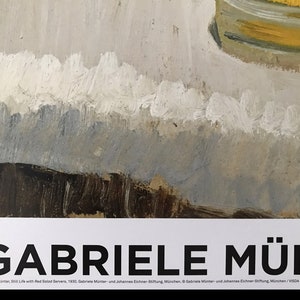 May include: A black and white poster with the text "GABRIELE M&Uuml;NT" in bold, large font. The text "Gabriele M&uuml;nter, Still Life with Red Solod Servers, 1930. Gabriele M&uuml;nter und Johannes Eichner Siftung, M&uuml;nchen. &copy; Gabriele M&uuml;nter und Johannes Eichner Siftung, M&uuml;nchen/VISDA 2018" is printed in a smaller font below the title.