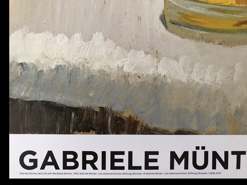 May include: A black and white poster with the text "GABRIELE M&Uuml;NT" in bold, large font. The text "Gabriele M&uuml;nter, Still Life with Red Solod Servers, 1930. Gabriele M&uuml;nter und Johannes Eichner Siftung, M&uuml;nchen. &copy; Gabriele M&uuml;nter und Johannes Eichner Siftung, M&uuml;nchen/VISDA 2018" is printed in a smaller font below the title.